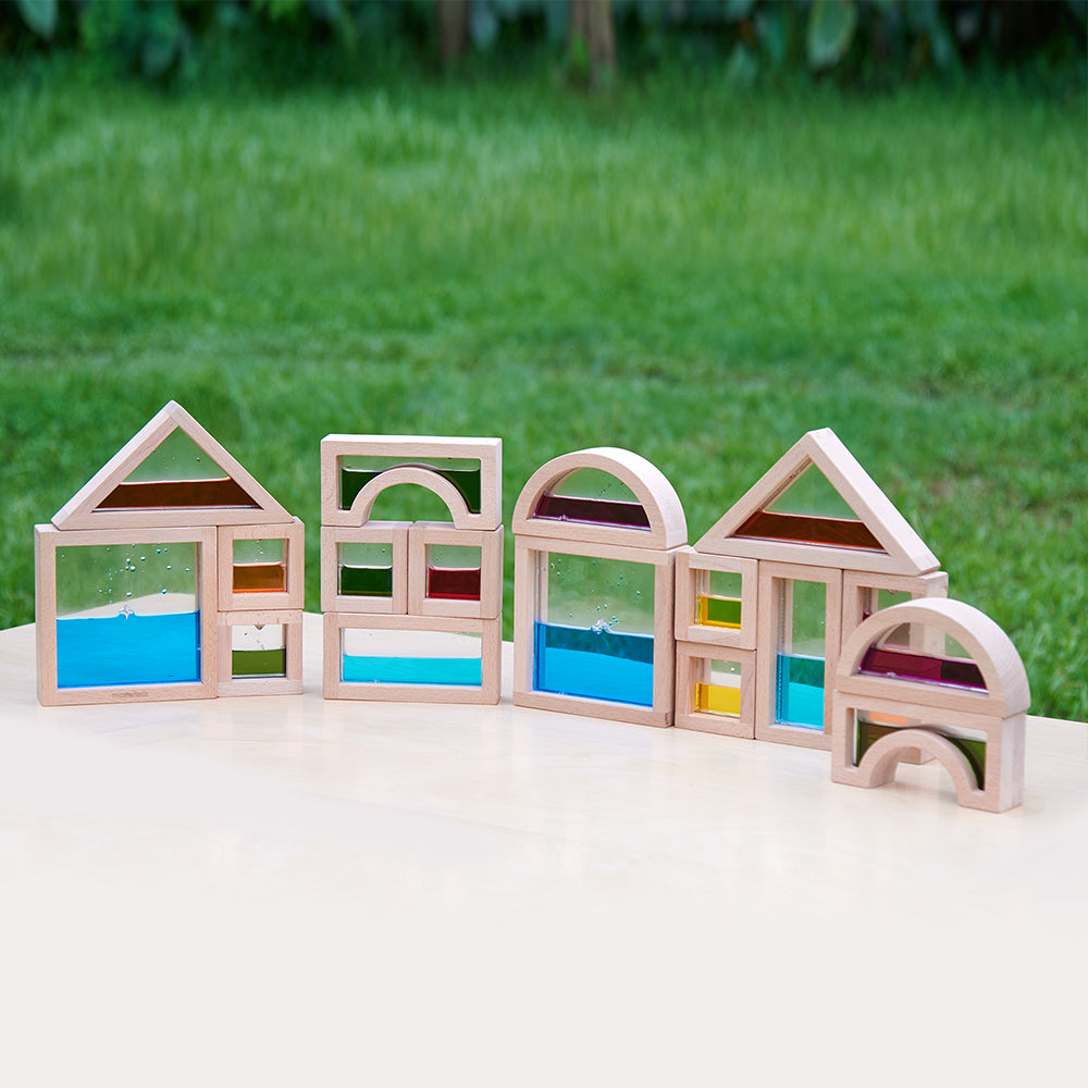 Child holding a liquid block to their eye to see the world change colour.