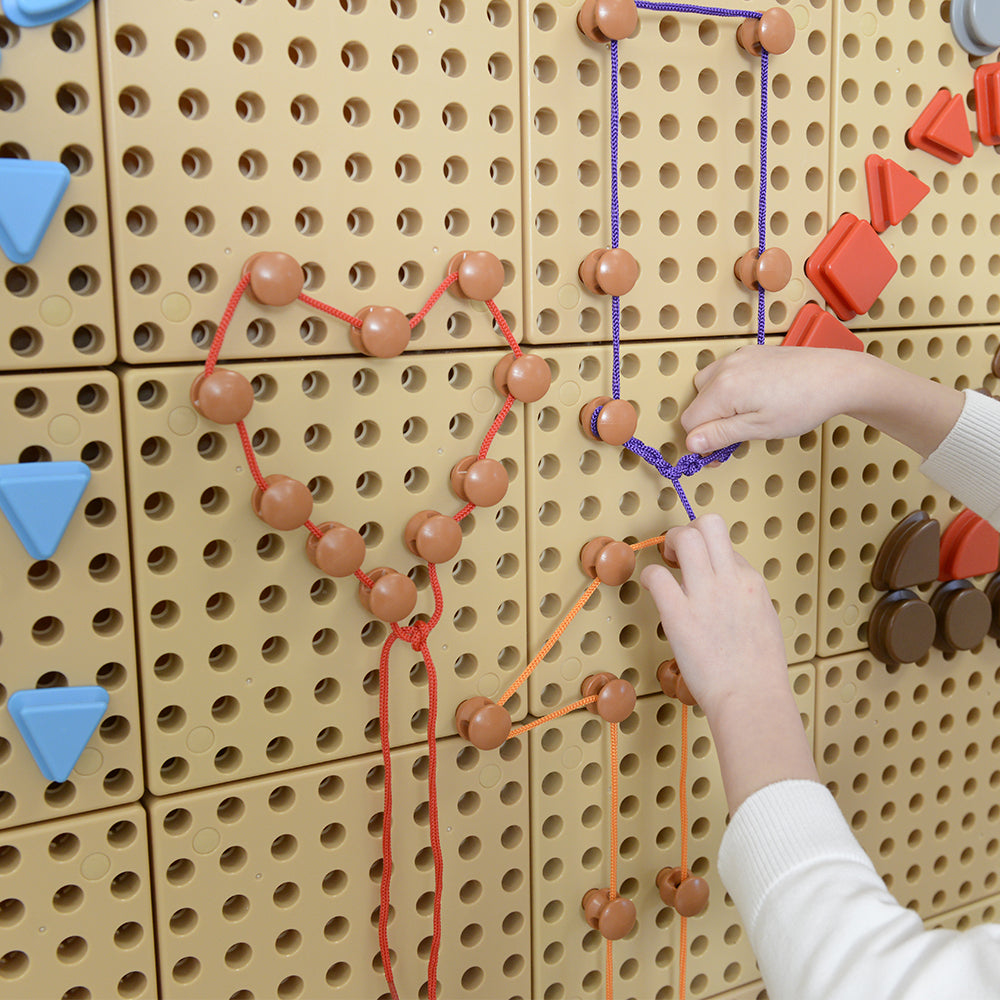 Masterkidz Lacing Pegs Set – Encouraging creativity and fine motor skill development with colourful strings.