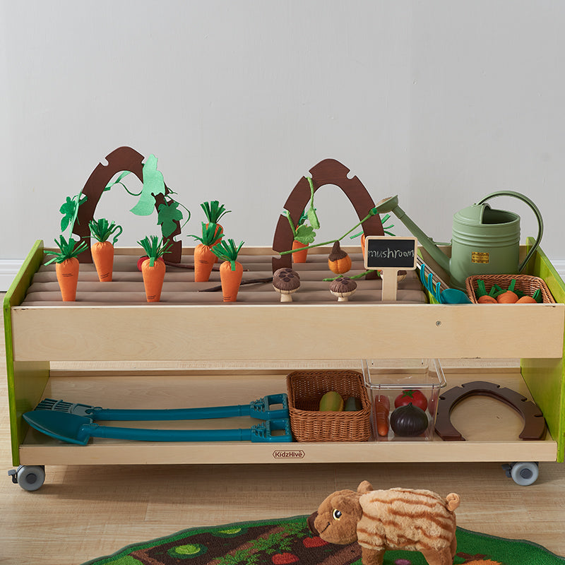 Close-up of hands interacting with fabric tubes, promoting fine motor development.