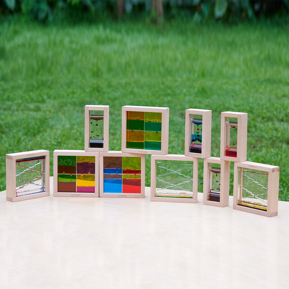Calming sensory play setup with bubble blocks and other visual toys.