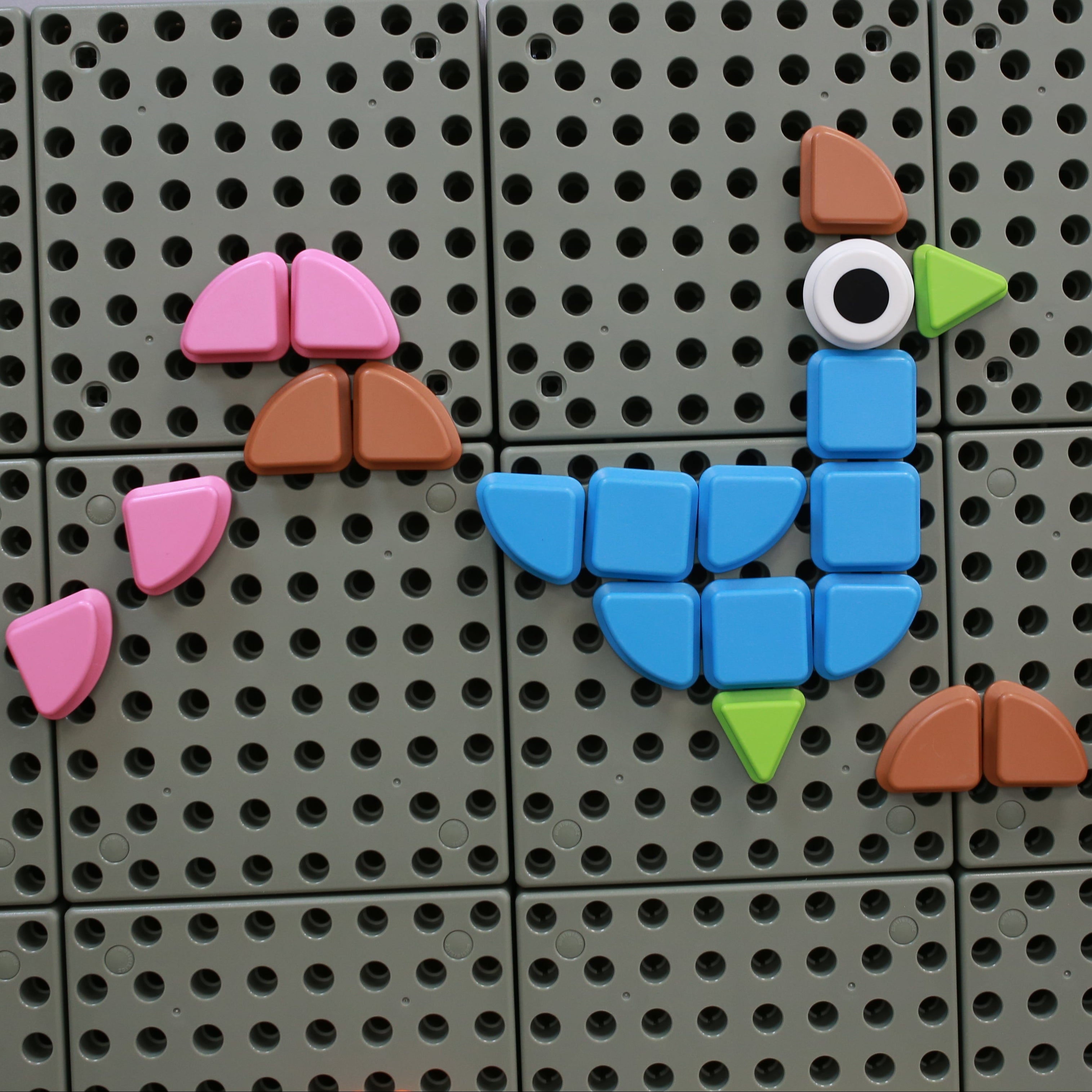 Children sorting and building patterns with Masterkidz STEM Wall Geometric Shapes Set 1 (64 Pieces).