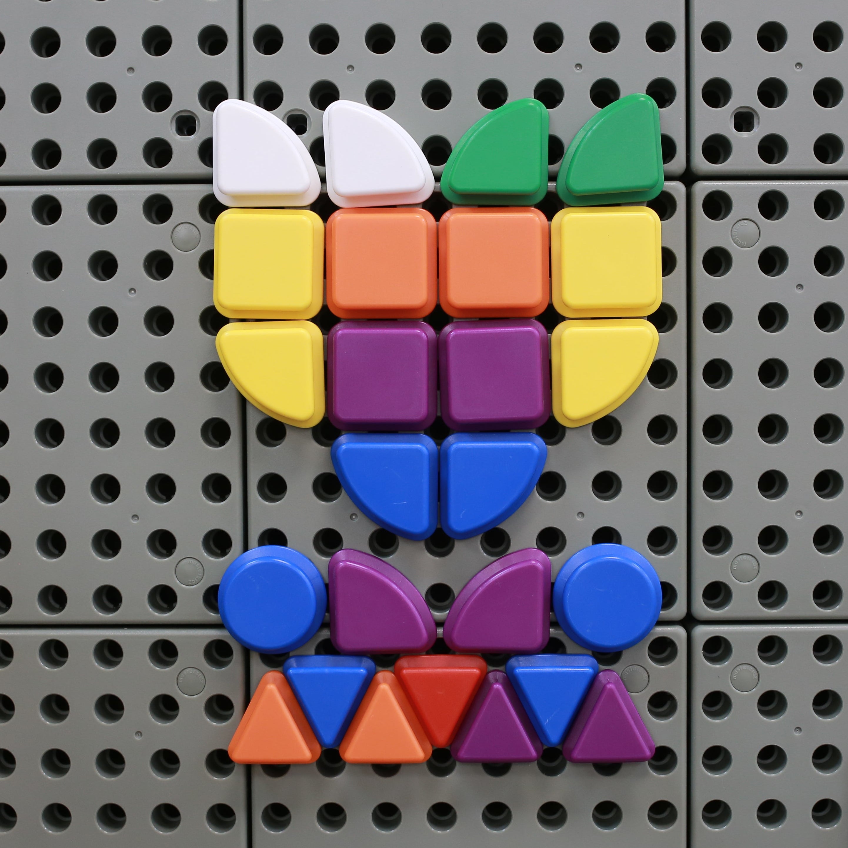 Developing spatial awareness and fine motor skills with Masterkidz STEM Wall Geometric Shapes Set 1.