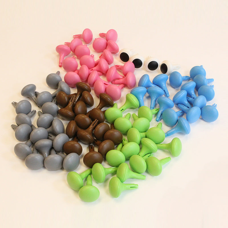 Close-up of 64-piece pastel peg set showing size and texture.