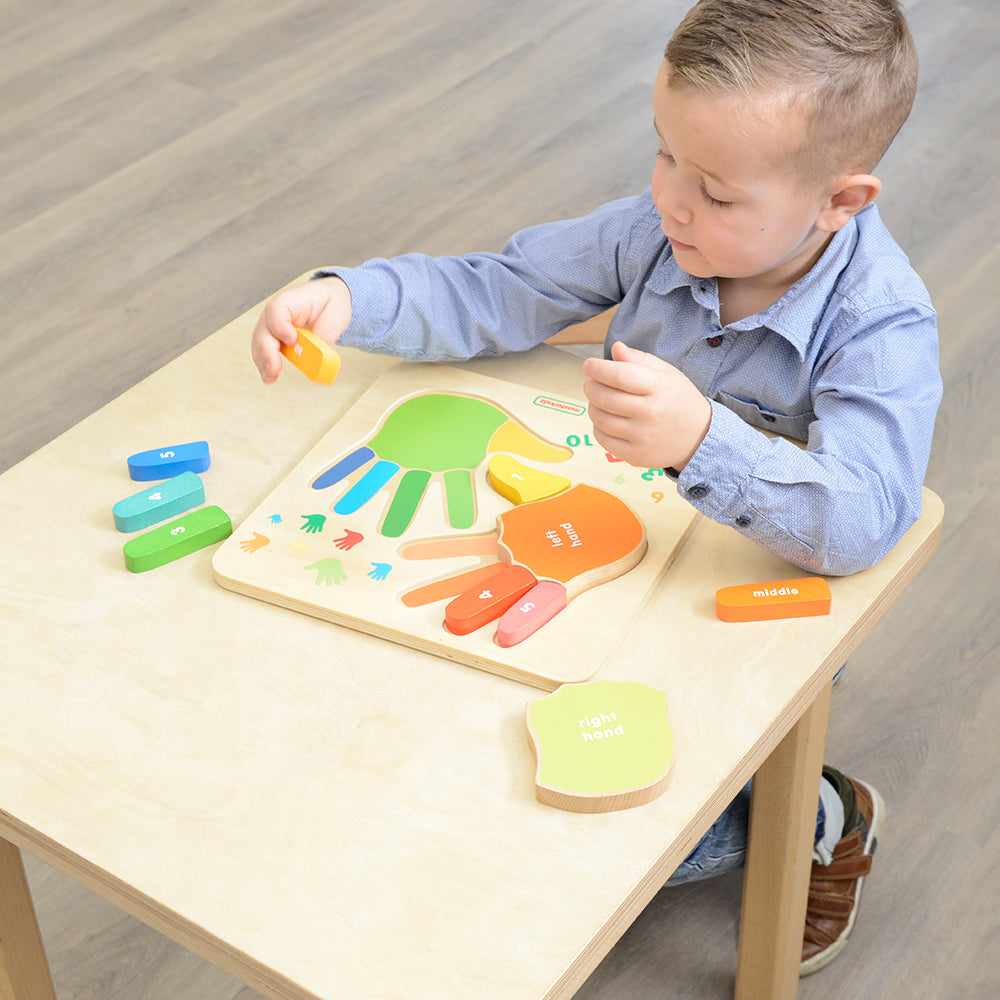 Finger-counting activity scene with kids identifying numbers through tactile learning.