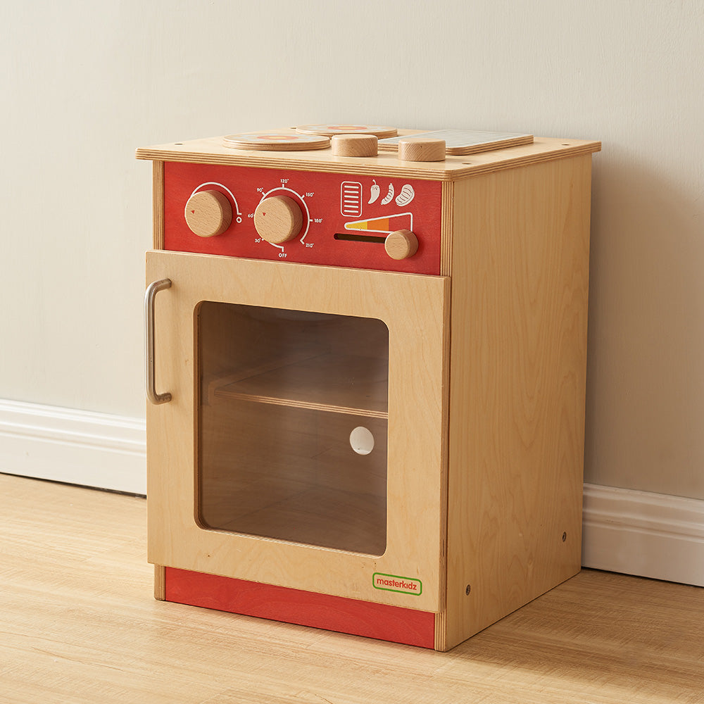 Masterkidz pastel wooden cooker unit with red highlights and hotplates.
