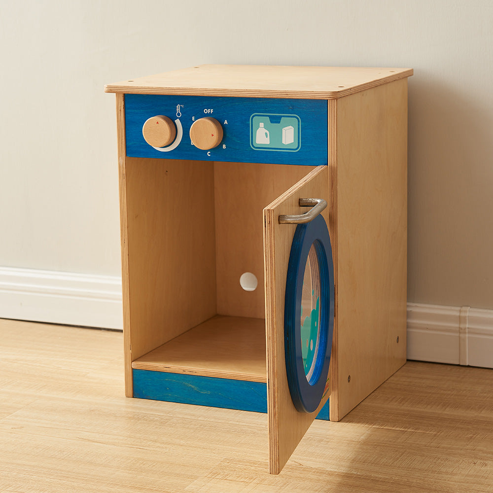 Child opening side door of wooden play washing machine.