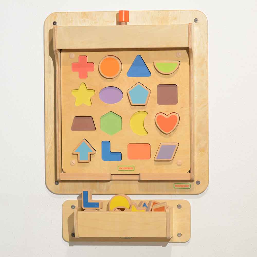 Wall-mounted magnetic panel used in preschool learning activities.