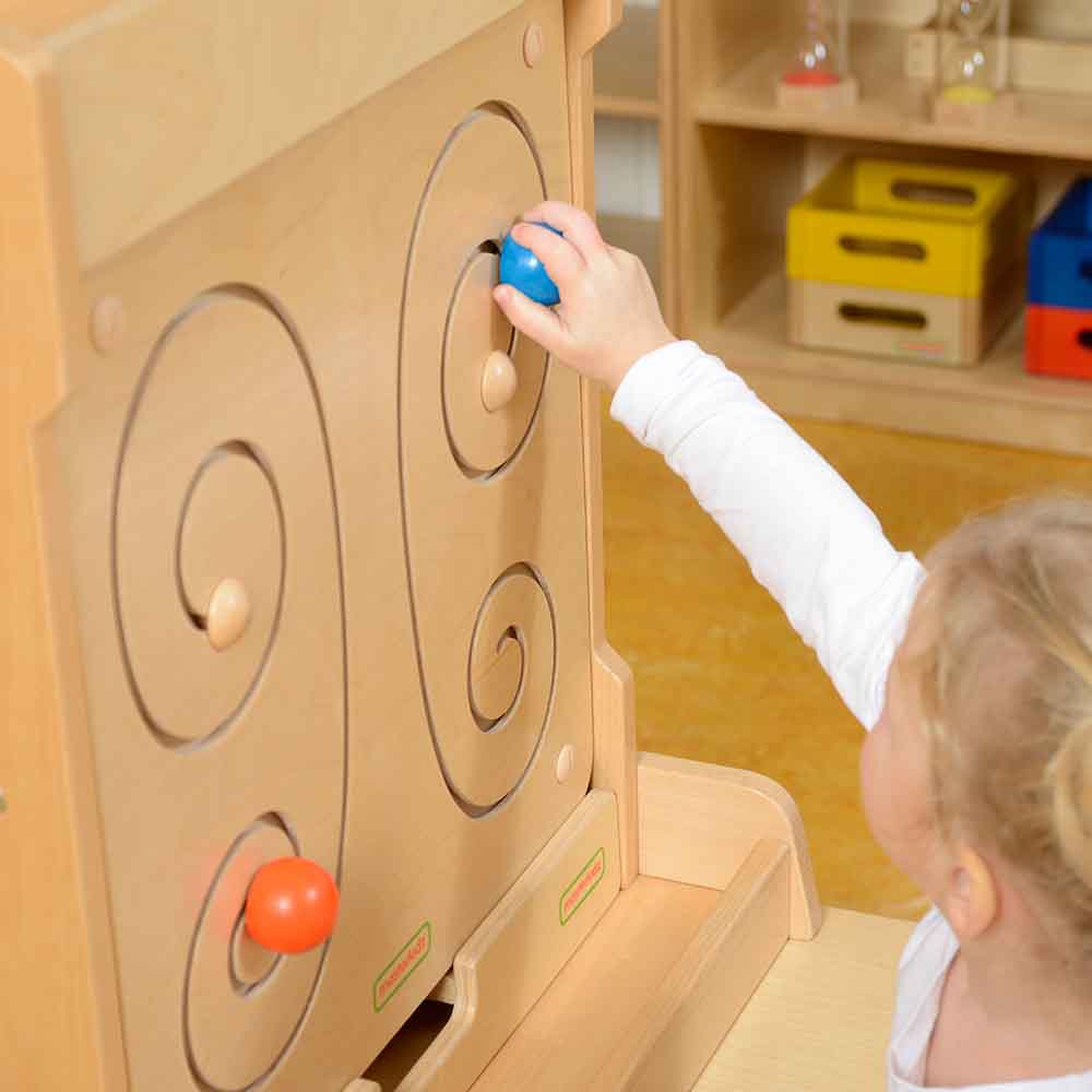 Close-up view of wooden maze pathways in butterfly wing design.