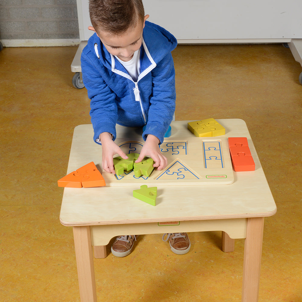 Kids solving shape puzzles on wooden learning board.