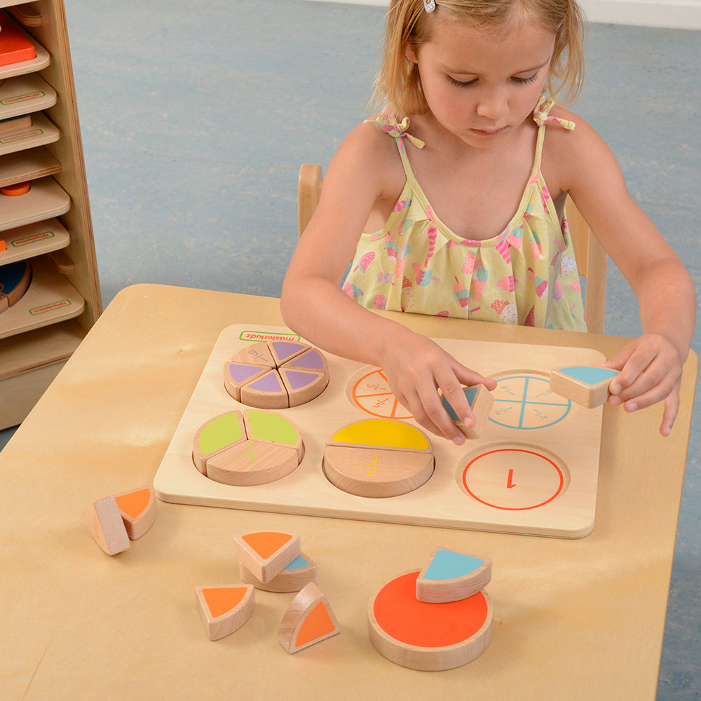 Children matching fraction puzzle pieces by colour and number