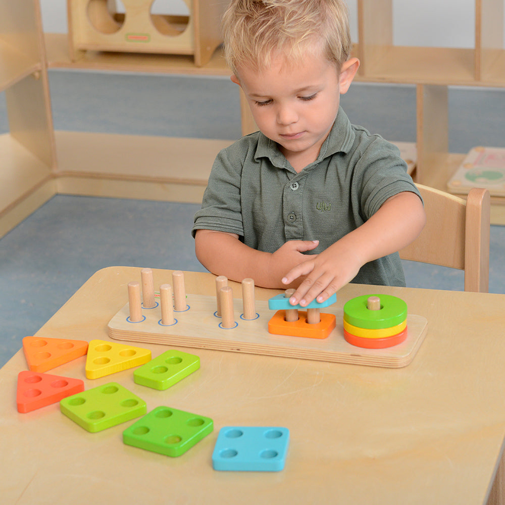 Fine motor skills learning activity with stacking game board