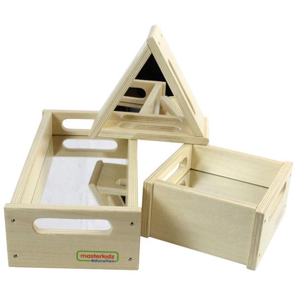 Children exploring shapes and reflections on mirror trays