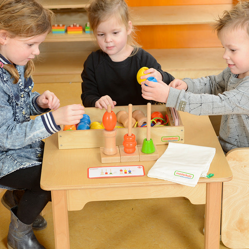 Children threading colourful beads for counting and matching