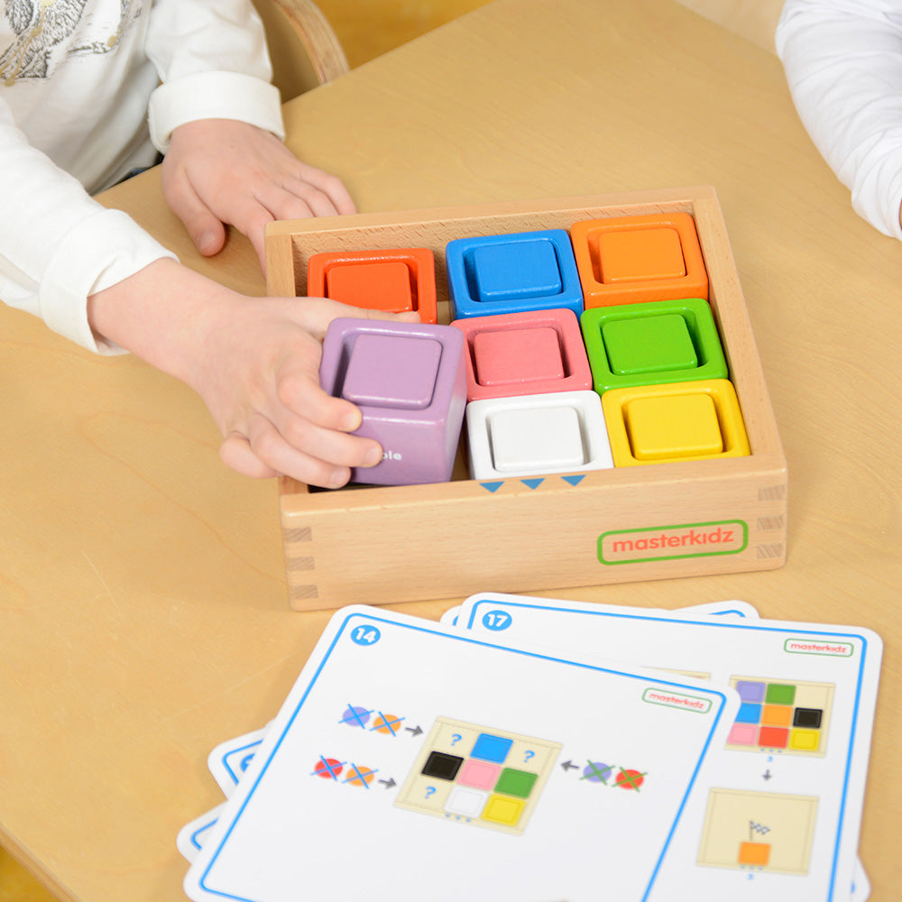 Fine motor skills development with square blocks and cups