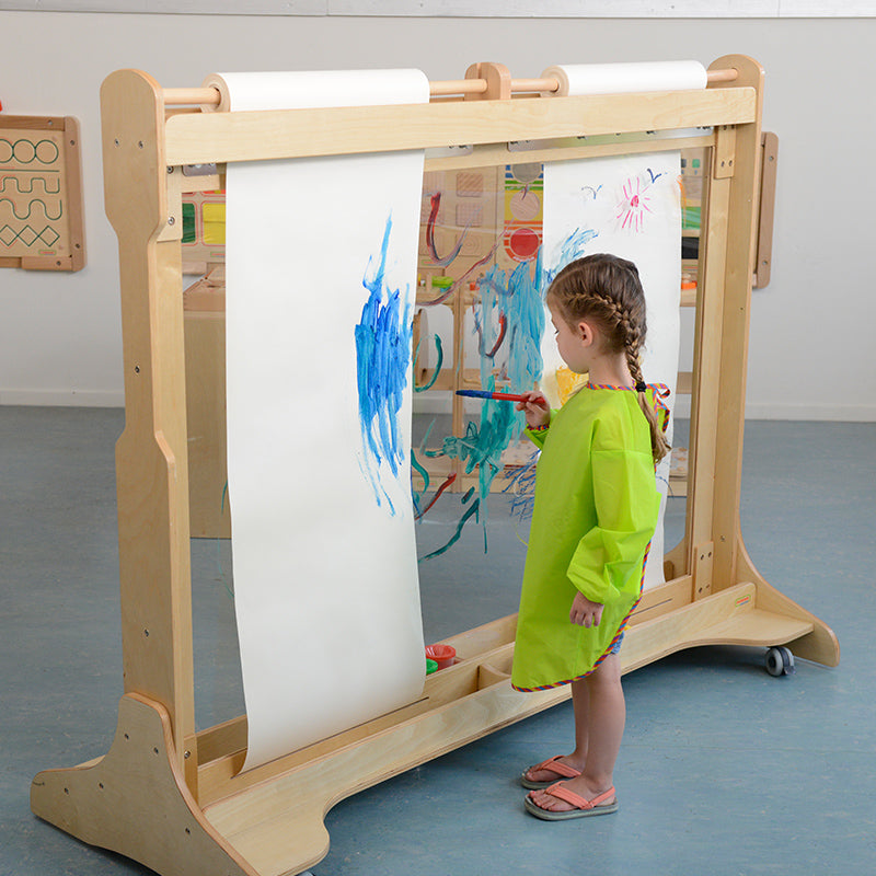 Collaborative art activity on freestanding painting wall