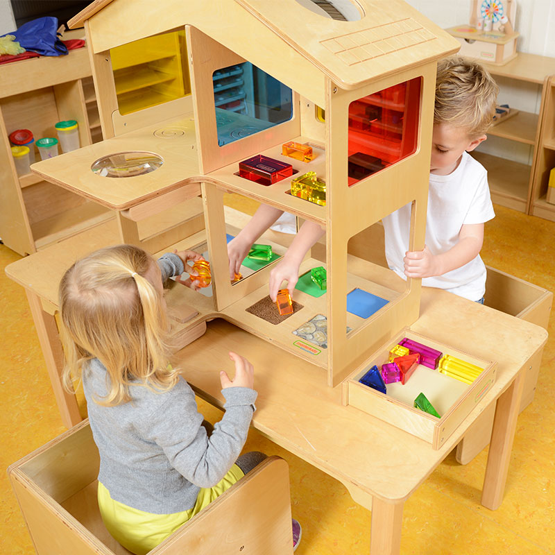 Sensory play house showing red, yellow, and blue windows for color recognition and mixing activities.