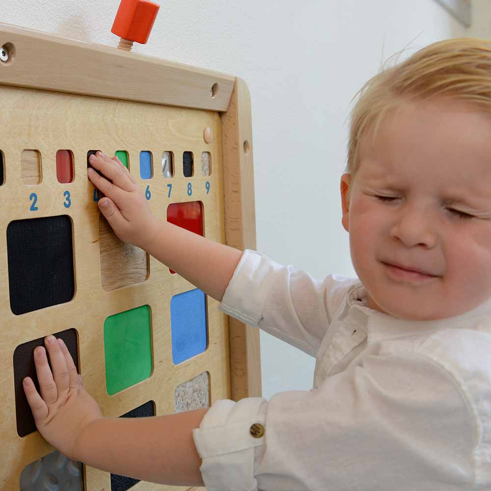 Sensory integration training wall panel for kindergarten classrooms