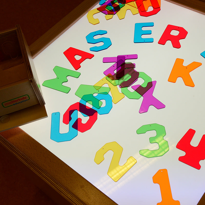 Colour mixing with translucent alphabet pieces on light box