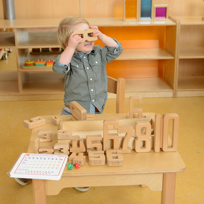 Children learning counting with tactile wooden numbers