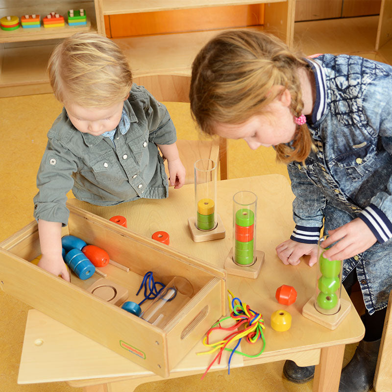Toddlers learning height, patterns, and sequencing with Masterkidz bead set