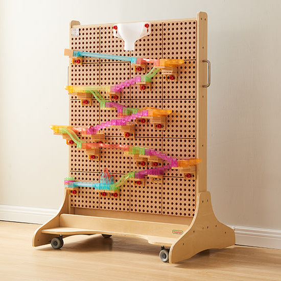 Children using colourful pegs to create patterns on the Masterkidz STEM WALL®.