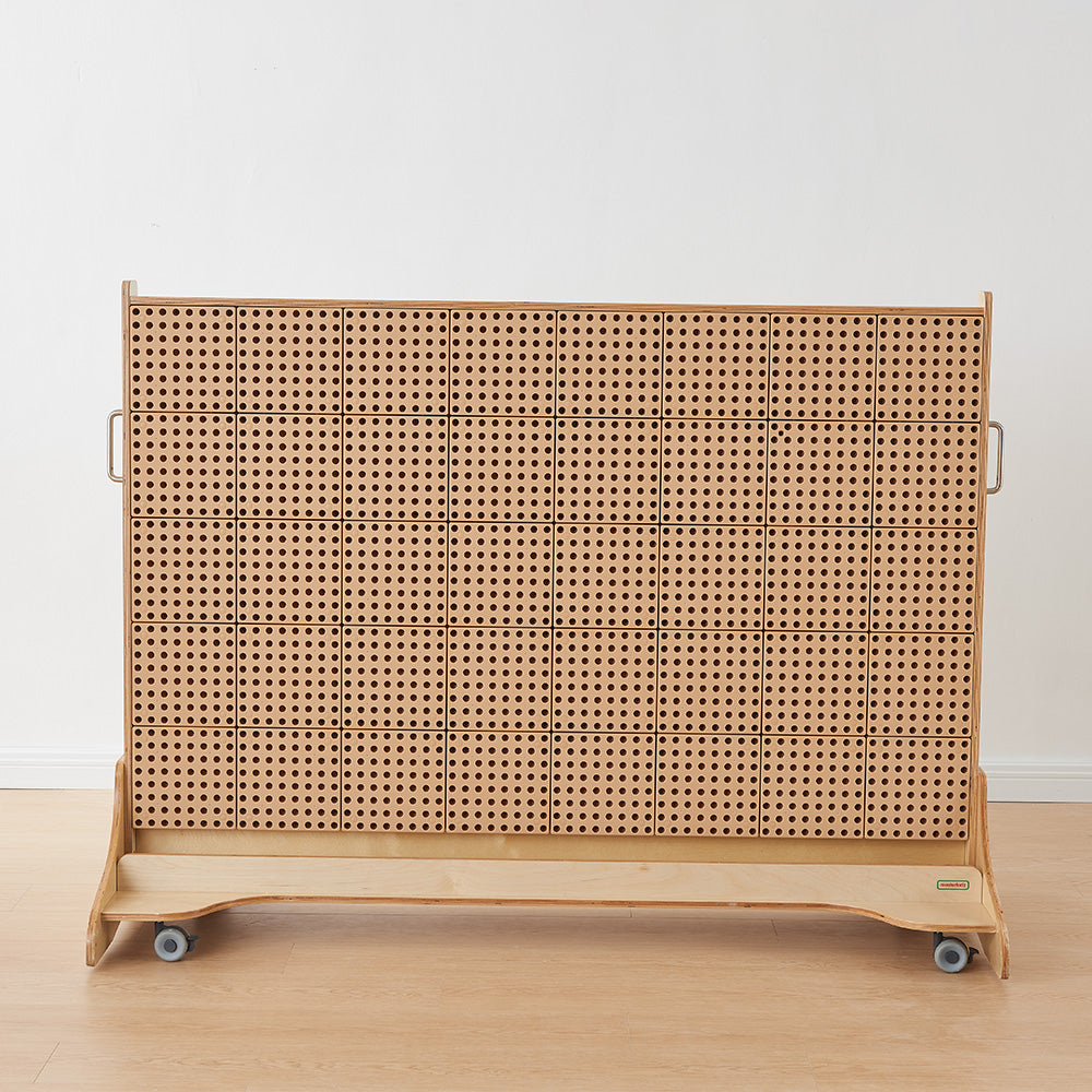 Teacher-led STEM session demonstrating cause-and-effect learning with water tubes.