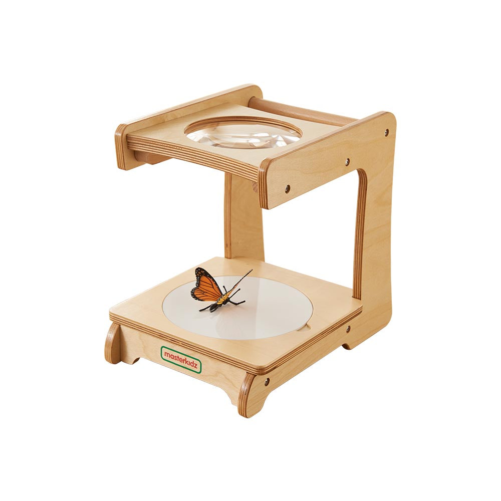 Science corner setup featuring Masterkidz magnifying tool.