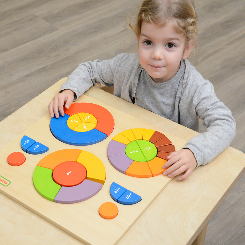 Kids exploring symmetry with wooden circular puzzle blocks