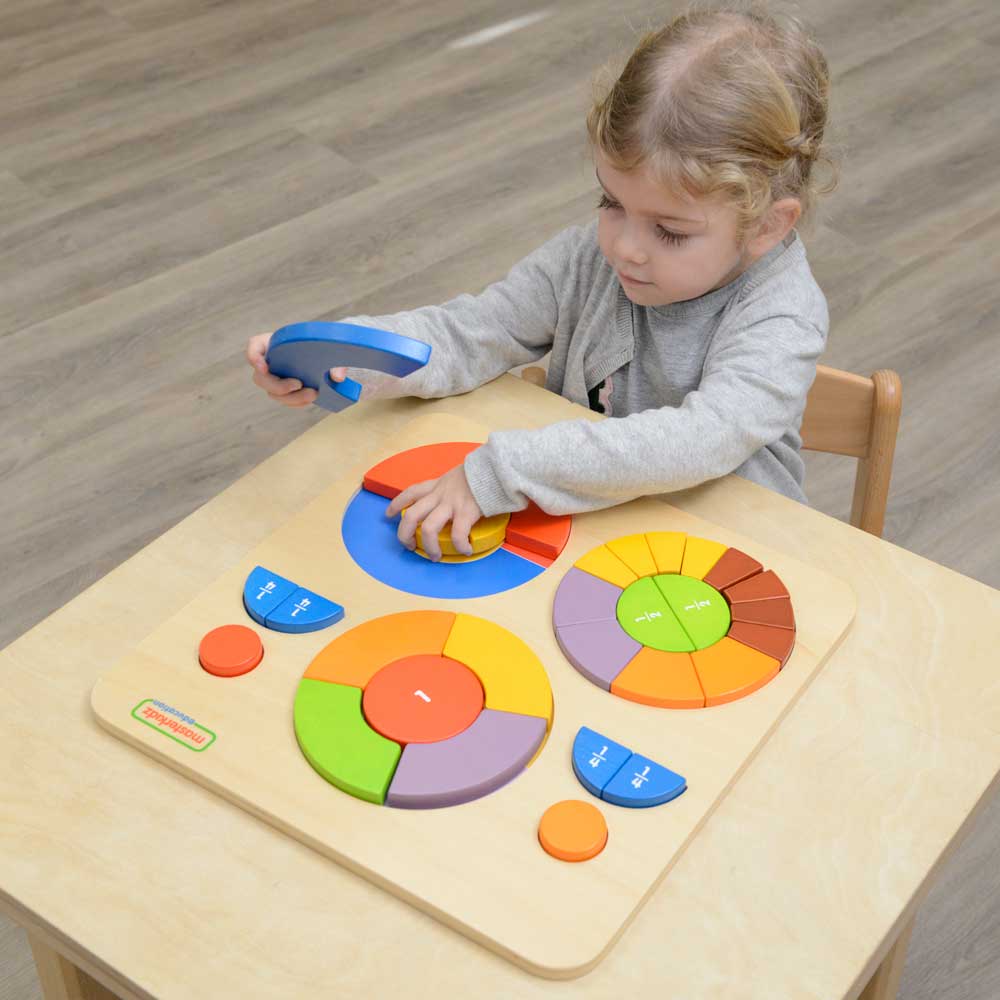 Children building circle patterns with wooden block segments