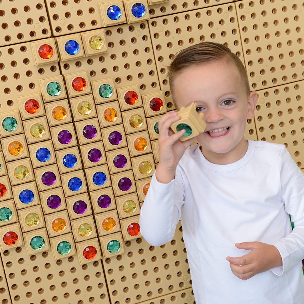 Children developing motor skills with Masterkidz STEM Wall Gem Stone Blocks 72Pcs – Enhance colour recognition and coordination.