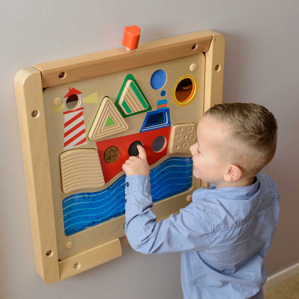 Interactive wall element promoting fine motor skills and sensory exploration