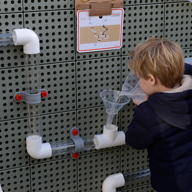 Teacher guiding students in engineering experiments using the STEM Tubes Set.
