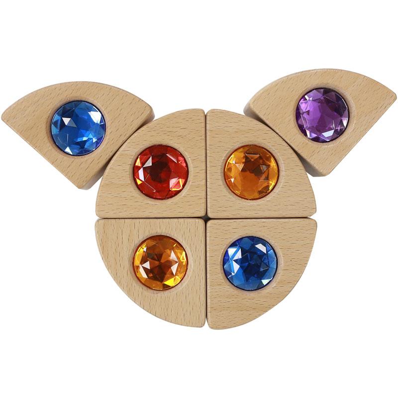 Brightly coloured Beech Wood blocks with embedded acrylic gemstones, encouraging toddlers’ creativity, tactile learning, and fine motor skills