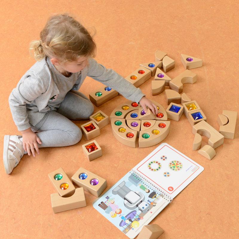 Children playing with 40 Beech Wood gemstone blocks at home, enhancing fine motor skills, creativity, and tactile stimulation