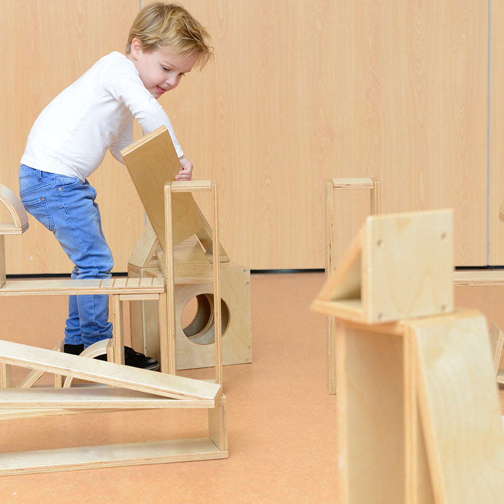 Children building ramps and castles with Masterkidz Giant Hollow Blocks 35Pc Set, promoting creativity and fine motor skills in preschool