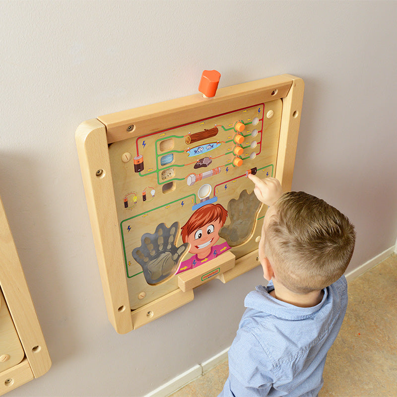 Children completing open and closed circuits on conductivity learning board