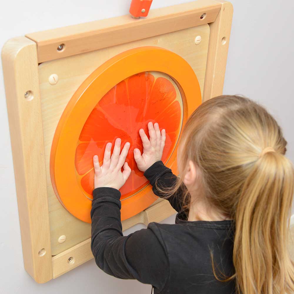 Tactile sensory wall panel with orange fluid bag for fine motor skills