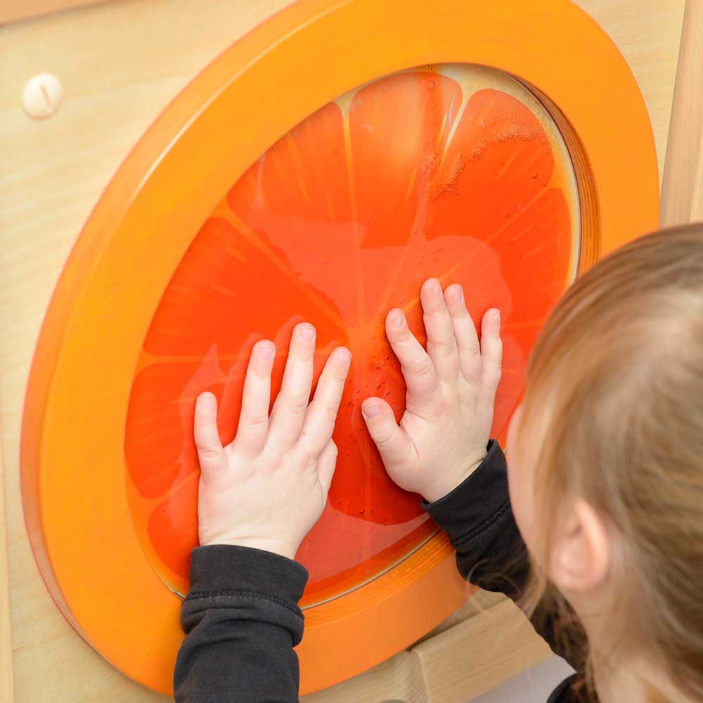 Tactile sensory wall panel with orange fluid bag for fine motor skills