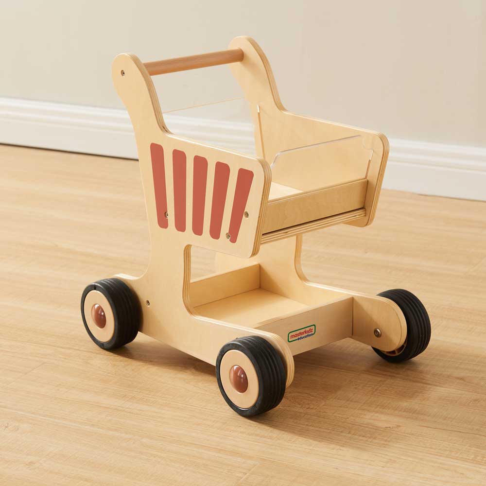 Toddler role play wooden shopping trolley in playroom
