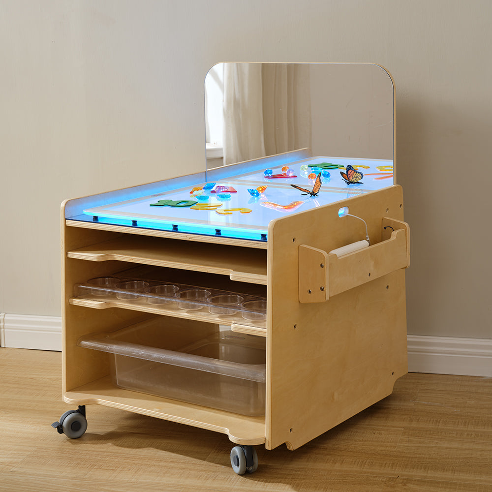 Masterkidz table being moved on its heavy-duty lockable wheels in a modern classroom setting.