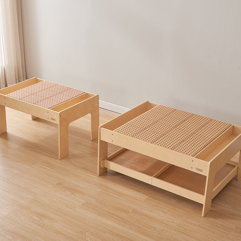 Toddlers exploring early engineering concepts with large plug-in resources.