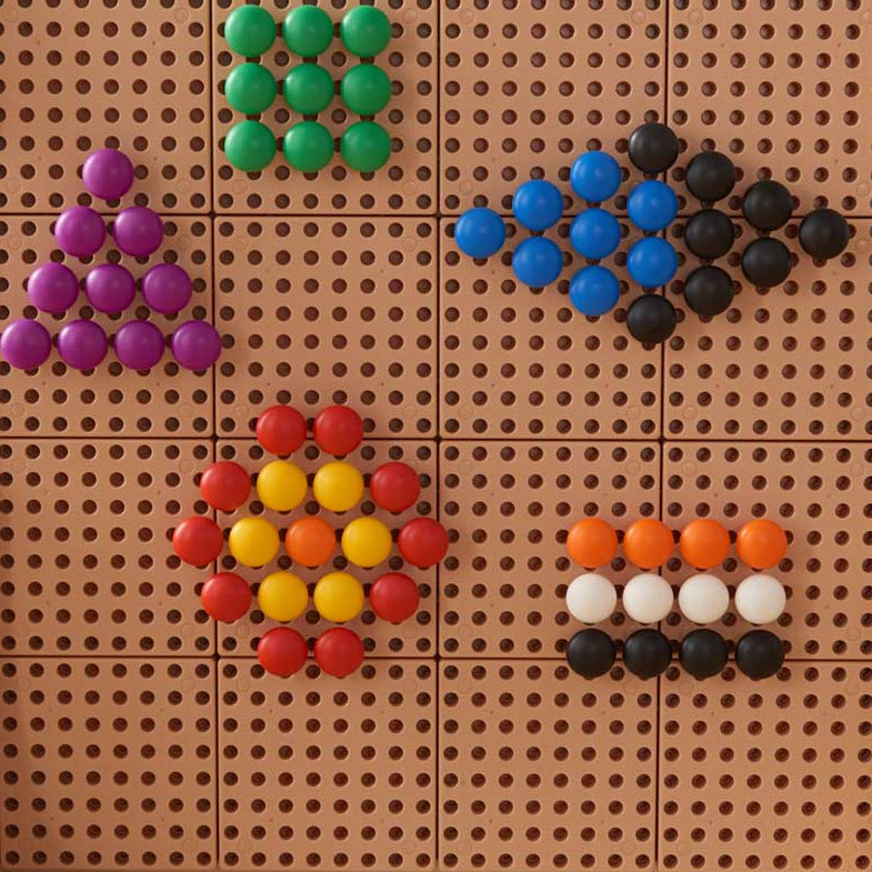 Teacher guiding children through colour sorting using jumbo STEM pegs.