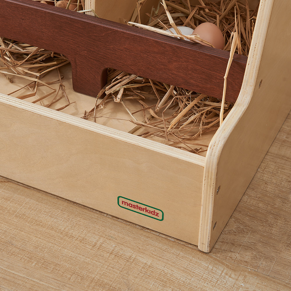 Pretend chicks positioned around the hen house for small world play.