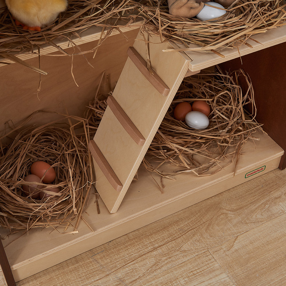 Children collecting eggs from the hen house for imaginative play.
