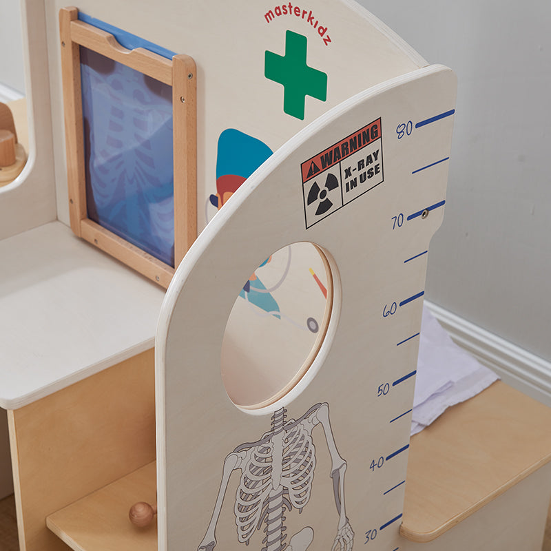 Children using Masterkidz clinic play set for pretend doctor and nurse role play