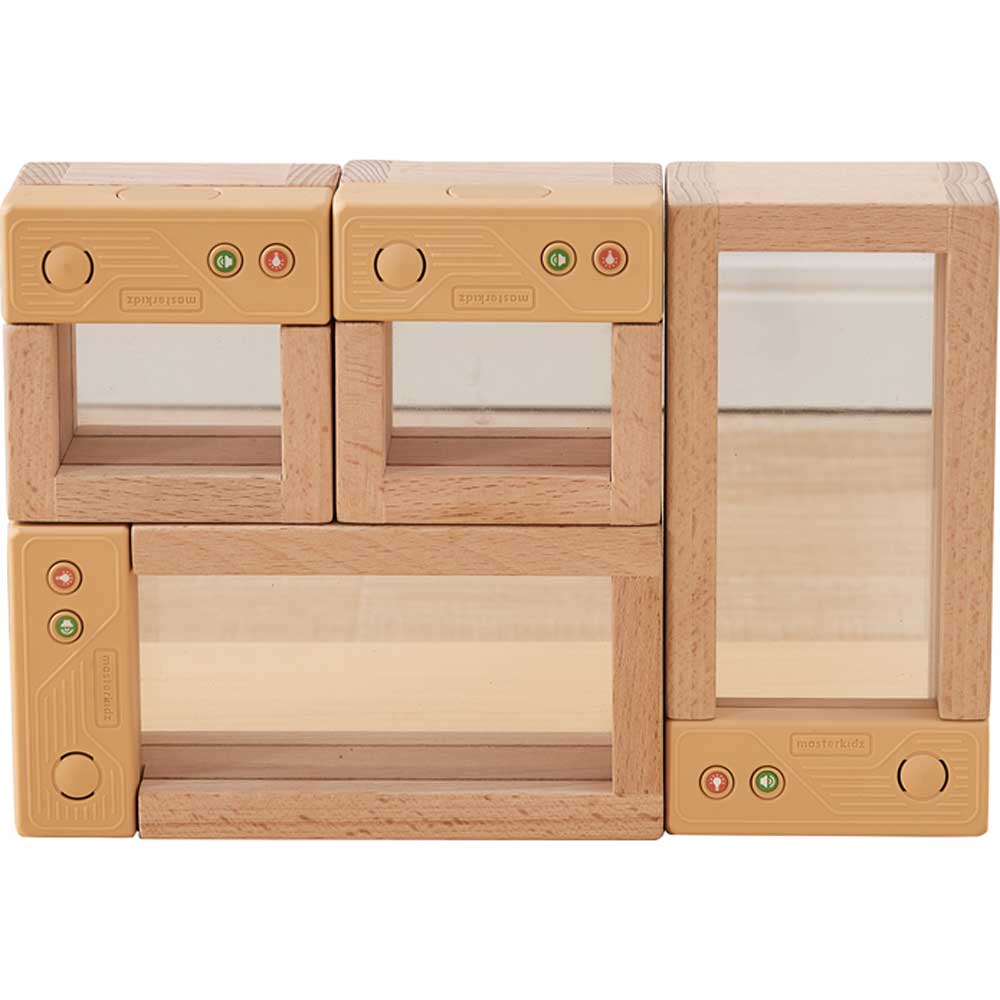 Children exploring nature items using light-up discovery blocks