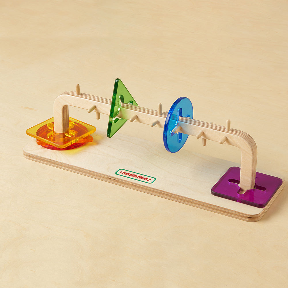 Sliding tile logic board for motor skill development