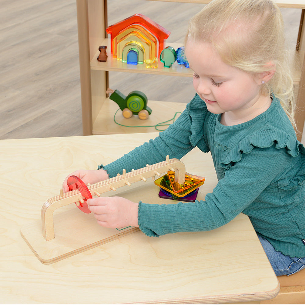 Kids practicing hand–eye coordination with sliding tile board