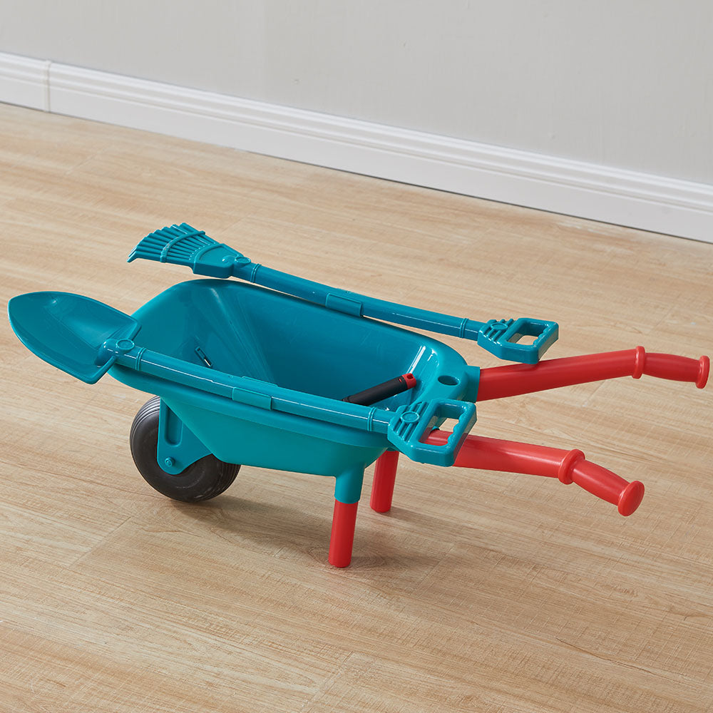 Double-sided hoe and cultivator placed beside miniature garden plots.