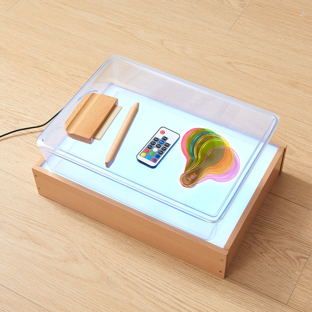 Compact beech wood light box with acrylic top for classroom use.
